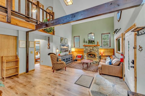 Living Room: 3-person couch, 4 chairs, 50” Smart TV, gas fireplace