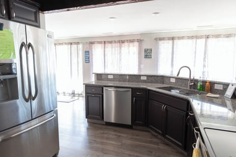 Kitchen downstairs with lots of windows overlooking the lake