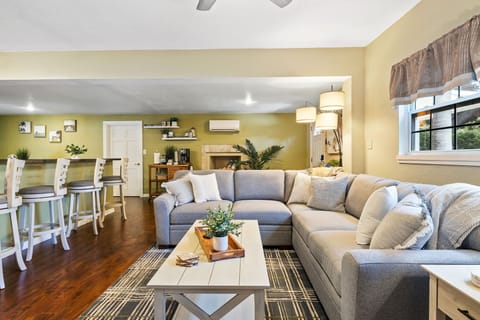 Sink into the plush sofa and enjoy the seamless flow from the living area to the kitchen