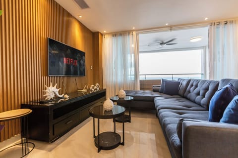 Experience luxury in a spacious living room equipped with a Smart TV, central A/C, and fast WiFi—perfect for streaming movies and YouTube concerts