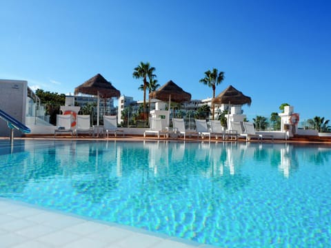 Outdoor pool, open 10:00 AM to 6:00 PM, free cabanas, pool umbrellas