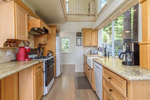 The open, airy kitchen offers ample space & every home comfort