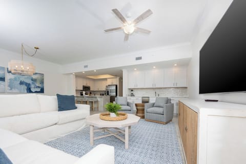 Relax on the cozy sofa with a queen sleeper in this inviting family room with a good movie