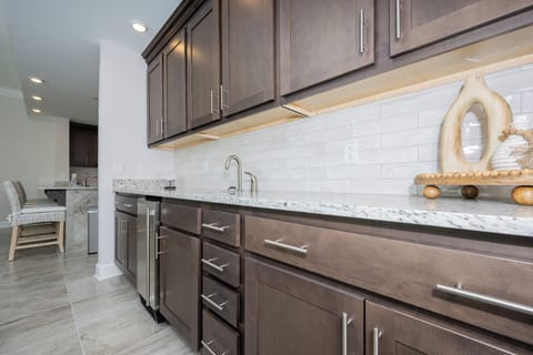 Grab a chilled drink from the fridge or create your favorite cocktail at the wet bar