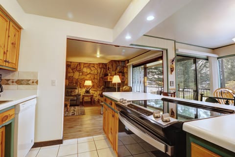 Open concept kitchen area looking out to living and dining room.