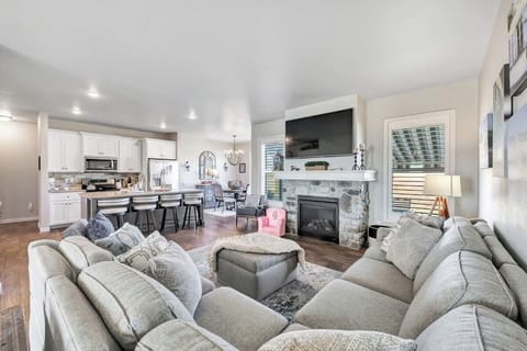 Living room with large-screen TV and seating area for 6 to 8 people