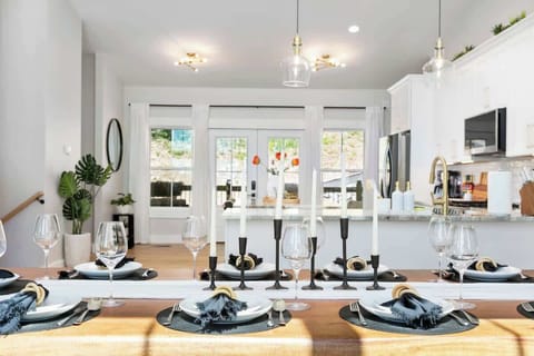 Gather around this beautifully set dining table, perfect for enjoying meals together with a view.