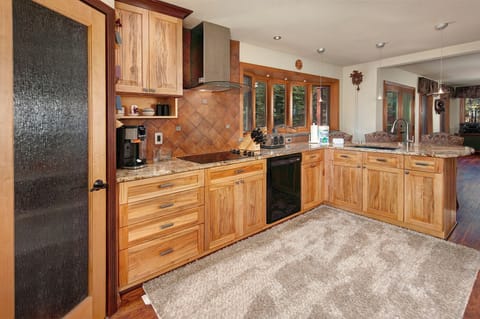 Full gourmet, chef's kitchen with stainless steel appliances.