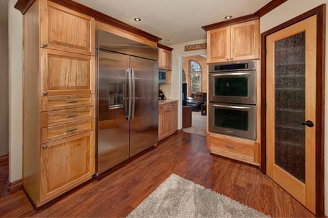 Full gourmet, chef's kitchen with stainless steel appliances.