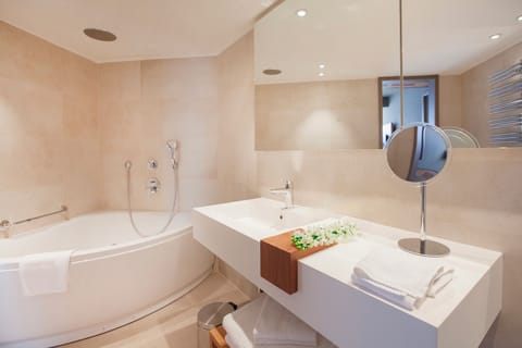 Deluxe Suite, Balcony, Sea View | Bathroom | Designer toiletries, hair dryer, bathrobes, slippers