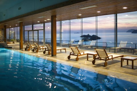 Indoor pool, seasonal outdoor pool, pool umbrellas, sun loungers