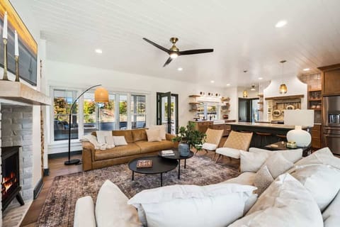 The open-concept living area invites you to relax in front of the gas hearth fireplace, with high-speed WiFi and Smart TVs available throughout the home for your entertainment. 