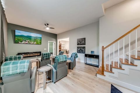 Lower level living area features an electric fireplace