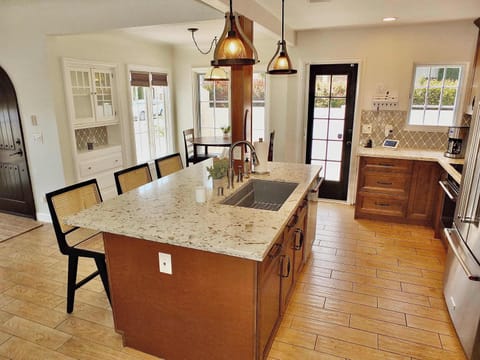 The warm, inviting kitchen offers ample space & every home comfort