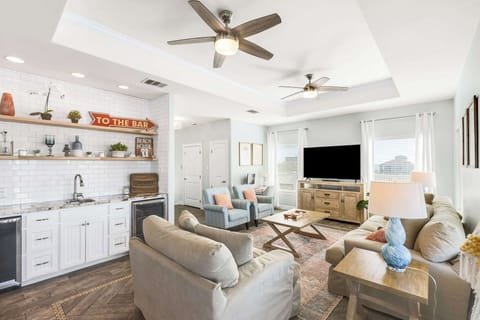 Find plenty of spots to lounge in the open 3rd Floor Living Room, with Smart TV and Wet Bar