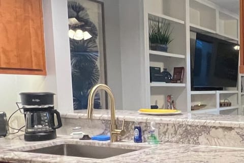 Farmers sink, Mr. Coffee maker, 
Mona Lisa granite counter top.