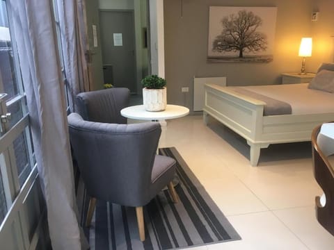 Deluxe Suite, 1 Queen Bed, Kitchenette, City View | In-room safe, individually decorated, individually furnished
