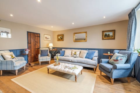 Sitting room - comfortably seats up to eight people, with cosy wood-burner 
