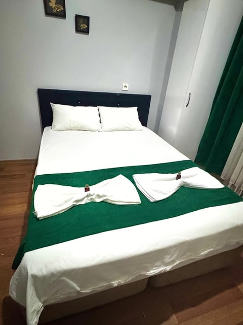 Premium bedding, desk, laptop workspace, blackout drapes