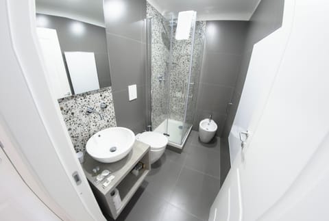 Superior Studio Suite, City View | Bathroom | Shower, hair dryer, towels, soap