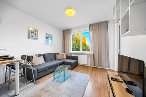 Living Room with Sofa and Smart TV | Book Now with RENTUJEMY.COM