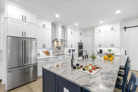 A spacious refrigerator, perfect for storing fresh ingredients, beverages, and all your culinary essentials.