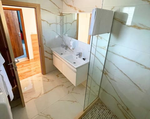 Deluxe Triple Room, Sea View | Bathroom | Shower, hair dryer, towels, soap