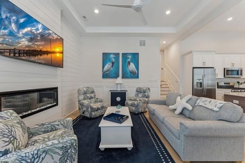 Inviting Living Room with Fireplace, Smart TV & Nautical Decor