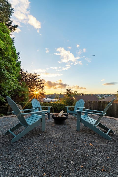 Enjoy the sunset in our backyard with Adirondack chairs and a cozy fire pit.