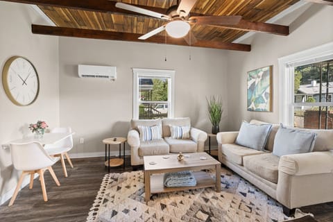 Comfortable couches and armchairs arranged for watching movies together.