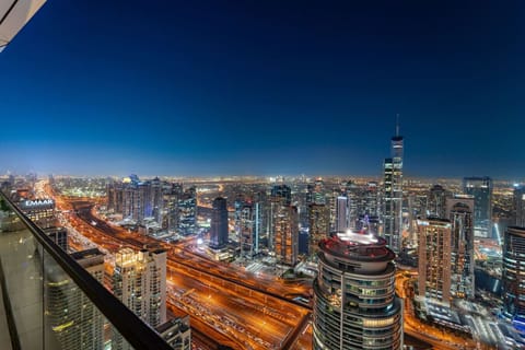 Skyline Balcony View: Dazzling city lights and a stunning skyline await from your private balcony!