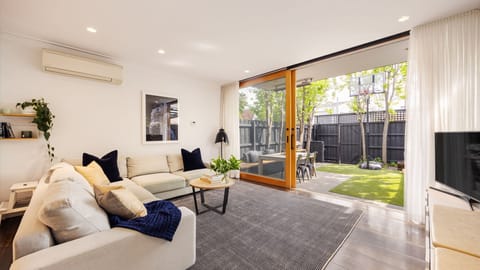 Living space with large sliding window doors to the courtyard