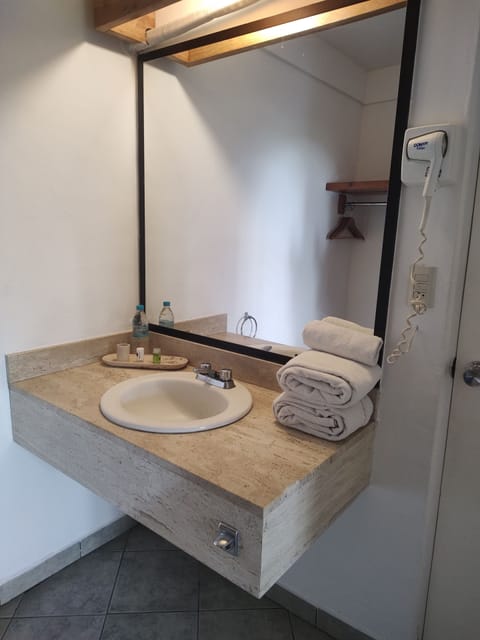 Deluxe Double Room, 2 Double Beds | Bathroom | Shower, rainfall showerhead, free toiletries, towels