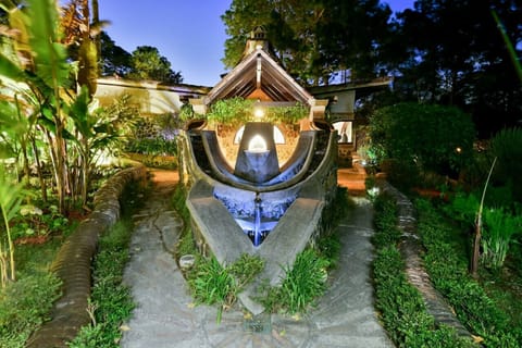 Water Hawk at twilight; "Azacuan" in Spanish.  Can you see the hawk's beak and eyes, water feature off the roof and the inverted roof that represents the wings.  We capture water into the cistern of and three other ones under the patio deck.