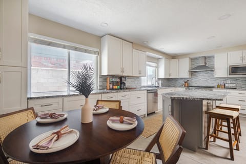 Open Kitchen & Dining Space – Modern kitchen with granite countertops