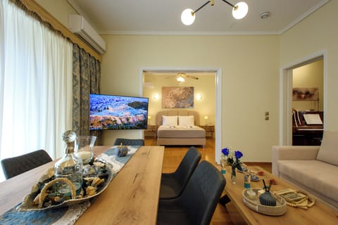 Signature Apartment, Balcony, City View | Living area | Flat-screen TV