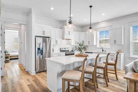 Kitchen - fully equipped for cooking, dining, and gathering around meals.