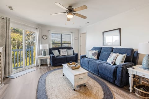 Spacious living area featuring 2 comfortable sofas.