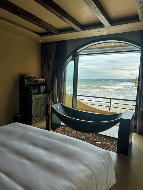 Deluxe Room, 1 Queen Bed, Partial Ocean View | Blackout drapes, soundproofing, iron/ironing board, free WiFi