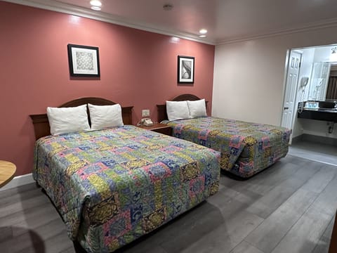 Standard Room, 2 Queen Beds | Desk, blackout drapes, free WiFi, bed sheets