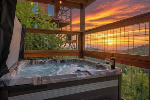 Soak in your private hot tub while taking in unforgettable Smoky Mountain sunsets
