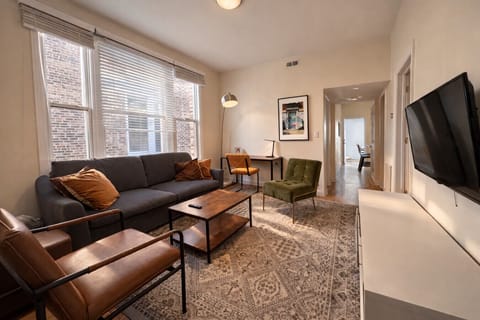 The perfect spot to unwind after a day of exploring Wicker Park, offering a seamless blend of comfort and productivity with a variety of seating options and a dedicated workspace
