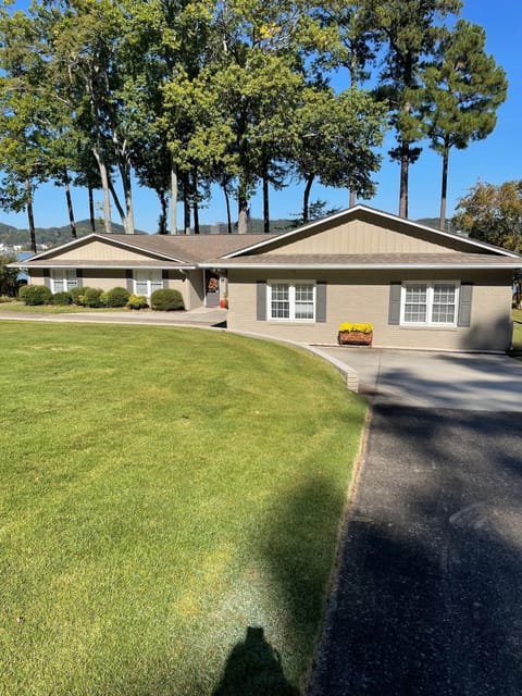 Four bedroom 4 bath home on lake with boat dock large circular drive for parking