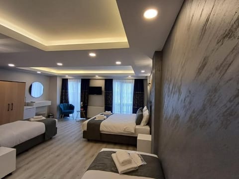 Deluxe Quadruple Room, Sea View | Premium bedding, soundproofing, iron/ironing board, free WiFi