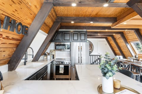 A chef's delight! The gourmet kitchen features sleek countertops, state-of-the-art appliances, perfect for meal prep or casual dining. Seating for 4 around the kitchen. A drip coffee maker is provided.