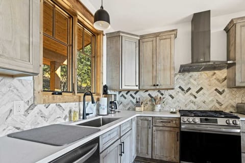 Kitchen with Basin Style Sink and Gas Range