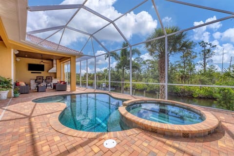 Sparkling saltwater pool &amp; spa overlooking water. Pool size is 17'L x 10'W x 6'D