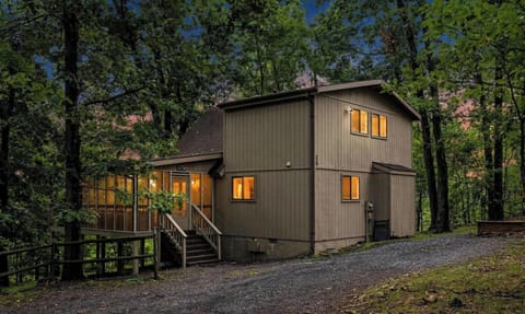 Escape to this cozy retreat tucked among the trees in The Woods community in Hedgesville. 