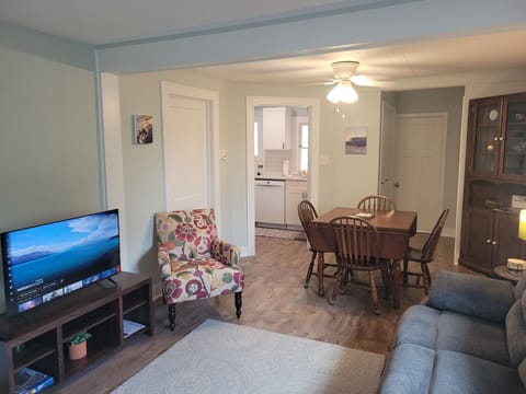 LIVING ROOM: Very cozy living room with a sofa, loveseat, chair, and streaming television.