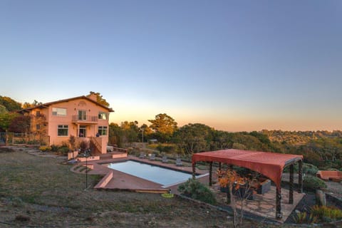 Heated pool and hot tub positioned to capture sweeping Sonoma vineyard views — the centerpiece of Burnside Villa's 5-acre estate